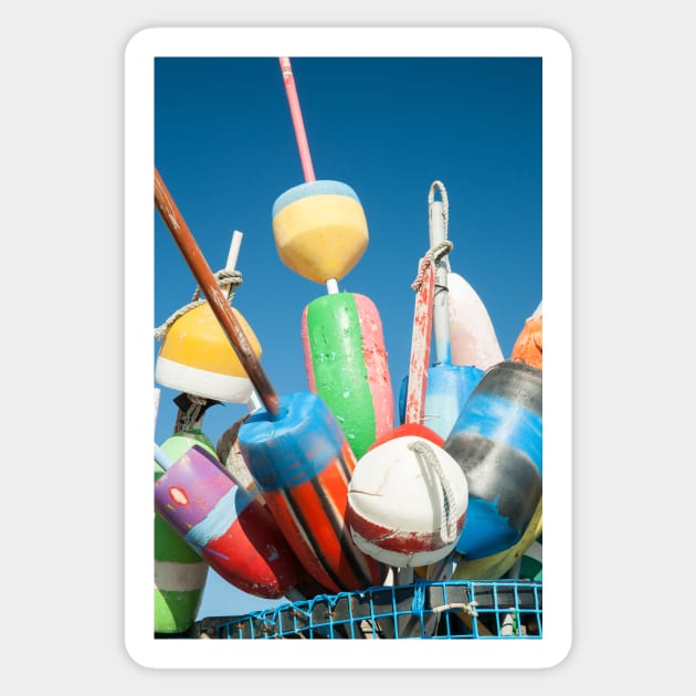 Collection of colorful fishing or lobster trap buoys and markers at wharf in Provincetown, Massachusetts, USA  Looks great on a sticker and even better as a canvas print on your wall. Sticker by brians101